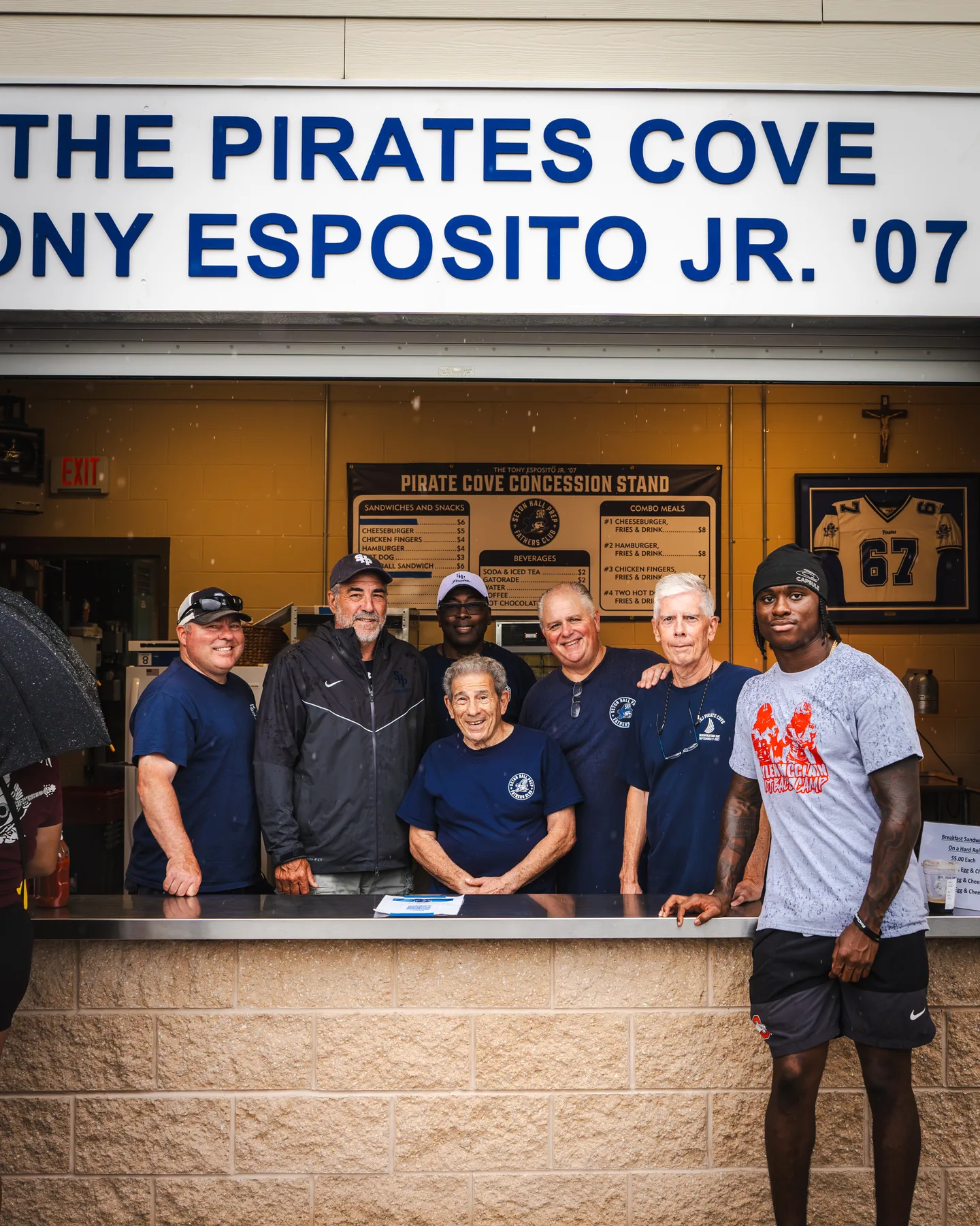 Jaylen McClain with longtime volunteers at the Pirates Cove concession stand.