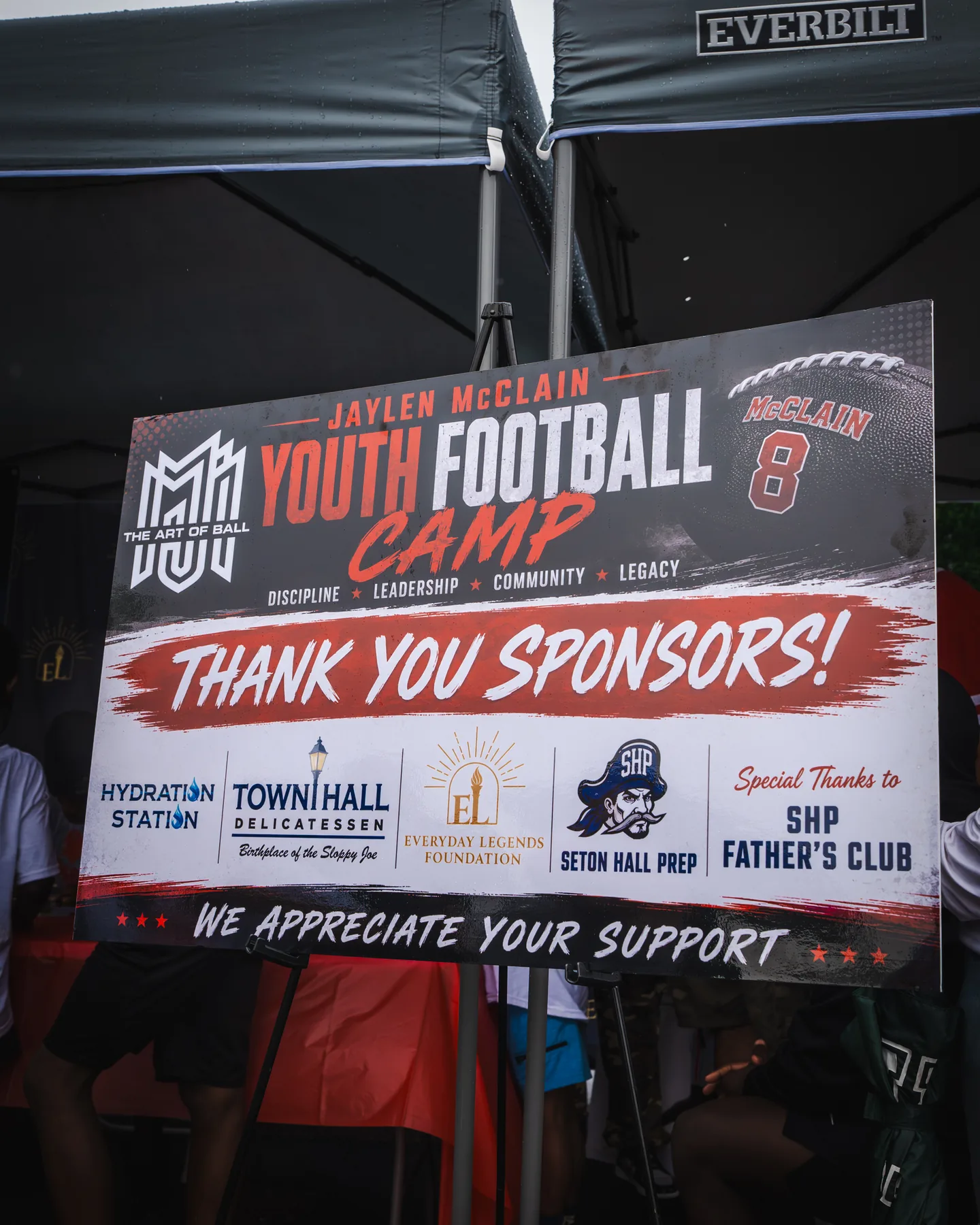 A sign thanks the sponsors of the Jaylen McClain Youth Football Camp.