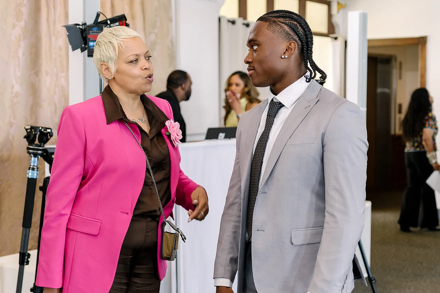 Jaylen McClain in conversation with a guest during the luncheon.