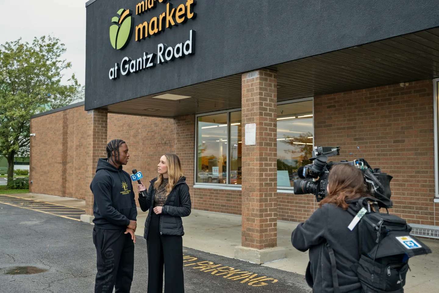 Jaylen McClain is interviewed outside Mid-Ohio Market at Gantz Road.
