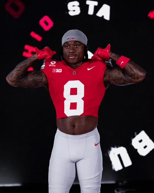 Jaylen McClain giving a thumbs up in his Ohio State jersey, against a graphic OHIO STATE backdrop.