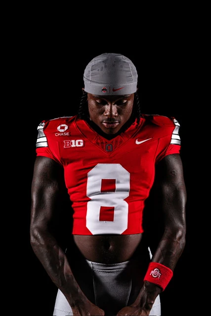Jaylen McClain in his No. 8 Ohio State jersey, studio portrait on black.